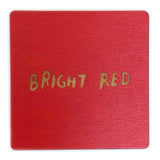 Photograph of a bright red color swatch