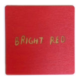 Photograph of a bright red color swatch